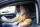 close-up-view-female-student-driving-car-instructor-holding-checklist-scaled.jpg